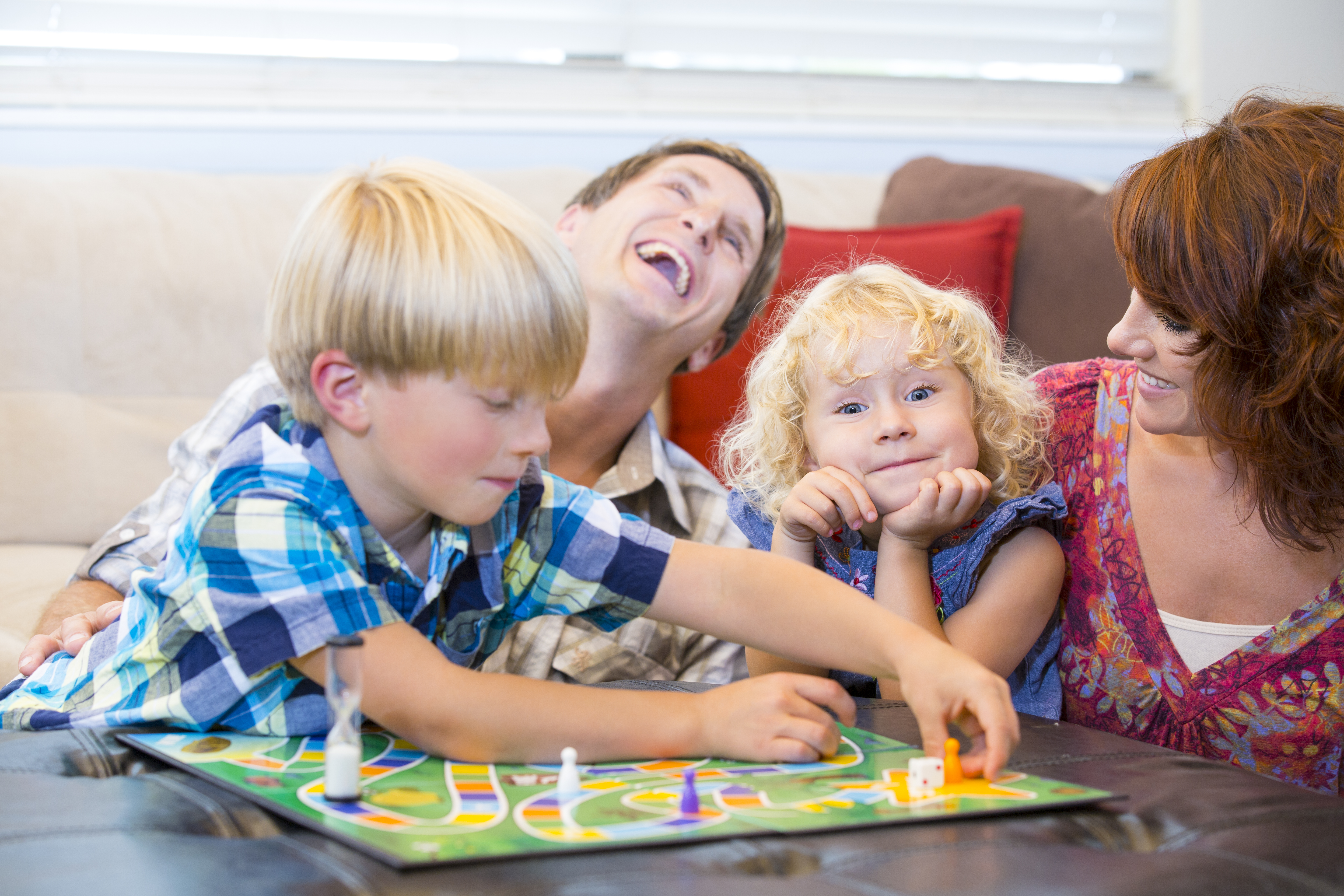 family playing board game