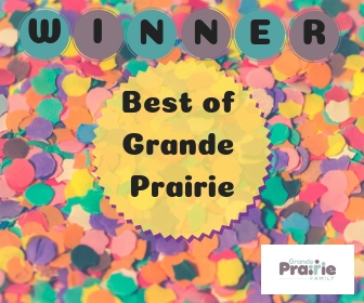 Text that says "Winner Best of Grande Prairie" over a sunburst overtop of coloured bits of paper