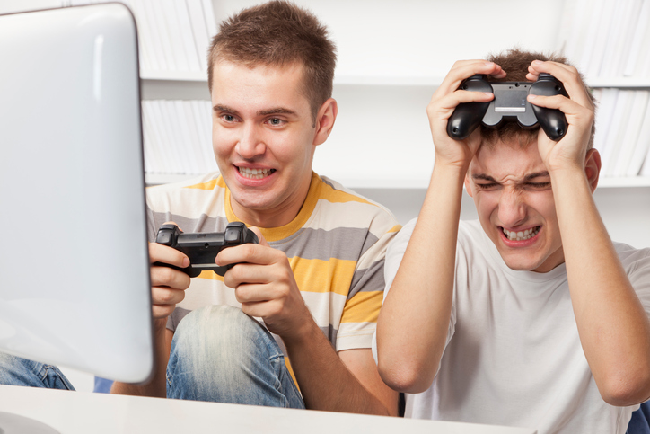 Teens gaming on a computer