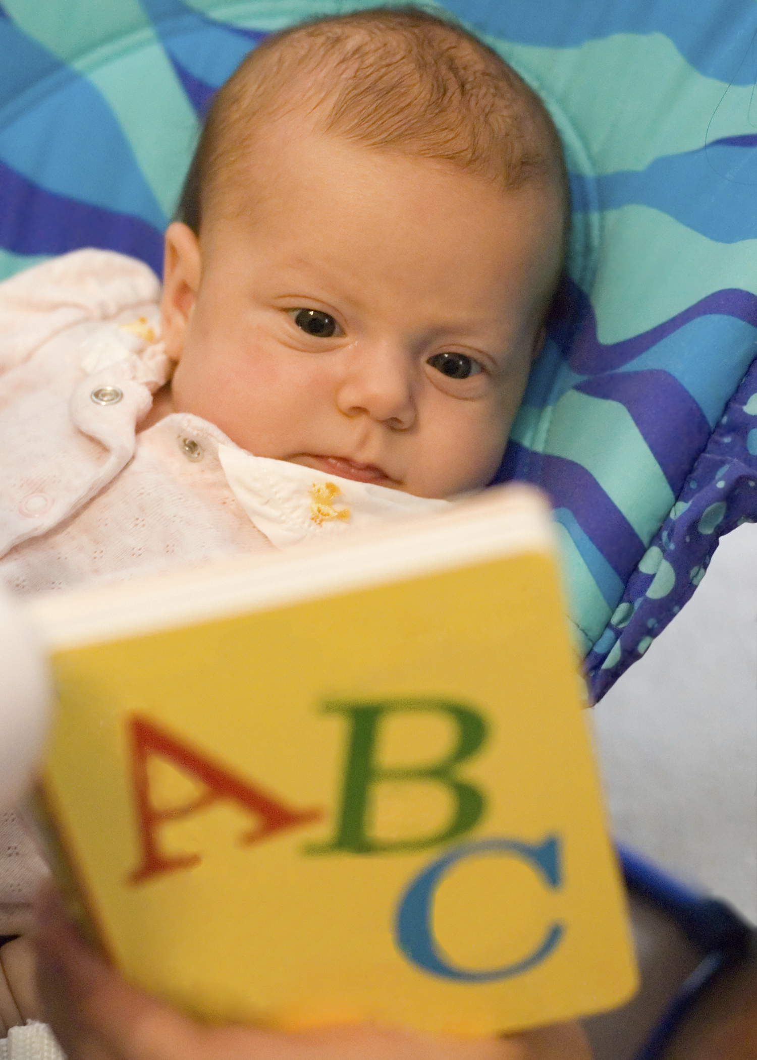 baby with ABC book