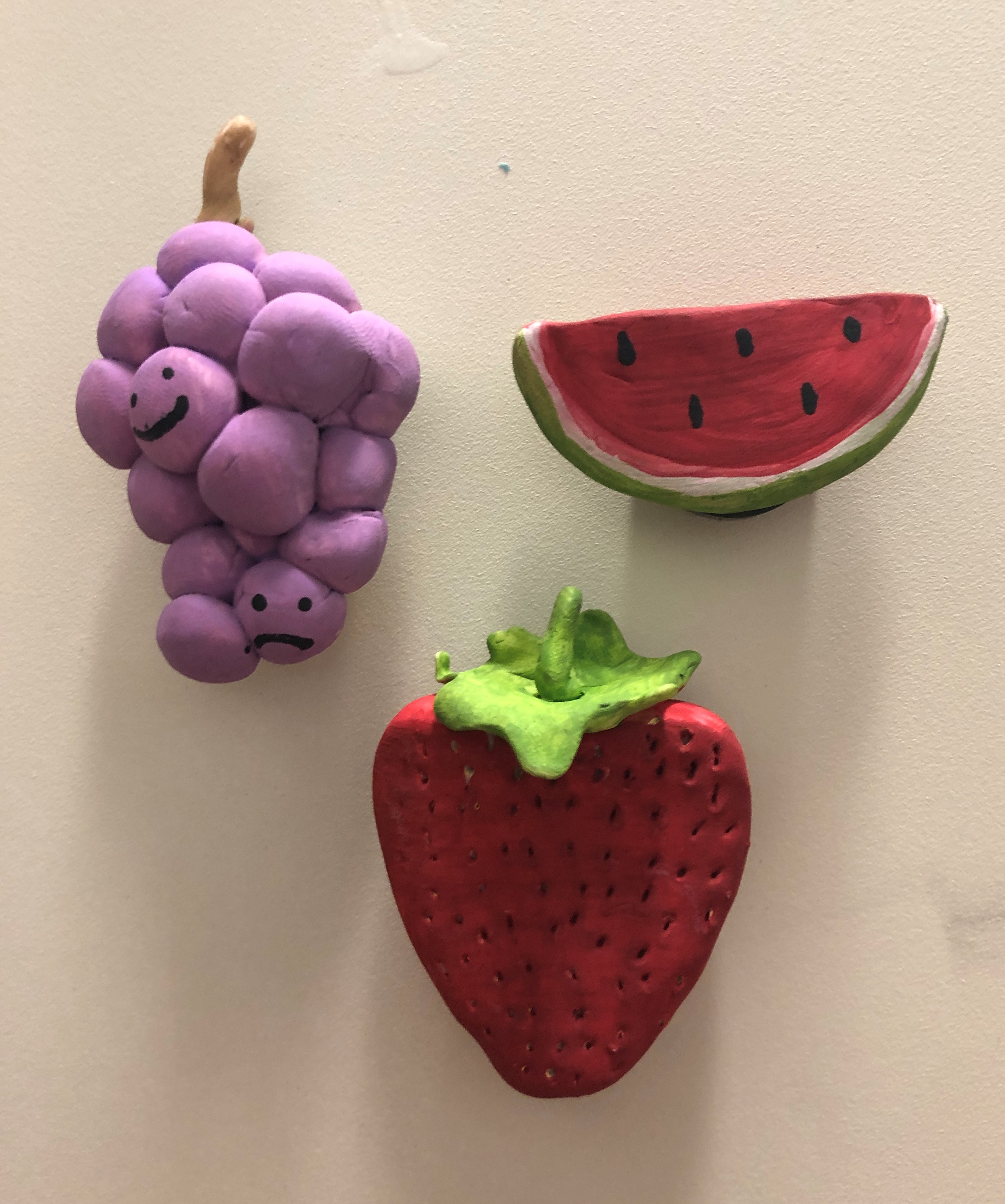 Strawberry, watermelon, and grapes made of clay