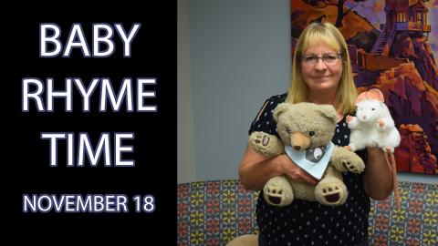 A woman holding puppets, standing next to the text "Baby Rhyme Time November 18"