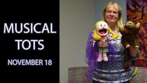 A woman holding two puppets stands next to the text "Musical Tots November 18"