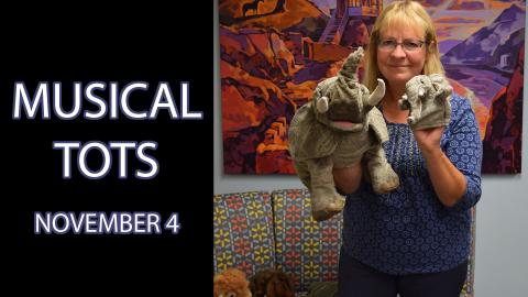 A woman holding various puppets next to the text "Musical Tots November 4"