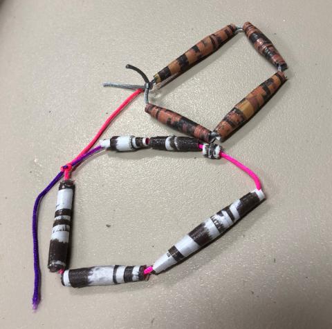 bracelets made out of brown, black, and white beads