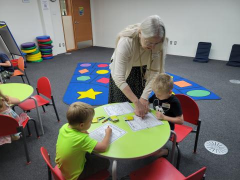 Judy leading preschool children in STEM activities.