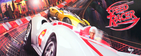 A young man drives a fast-looking white car in front of a yellow car further back on a twisty, futuristic track.