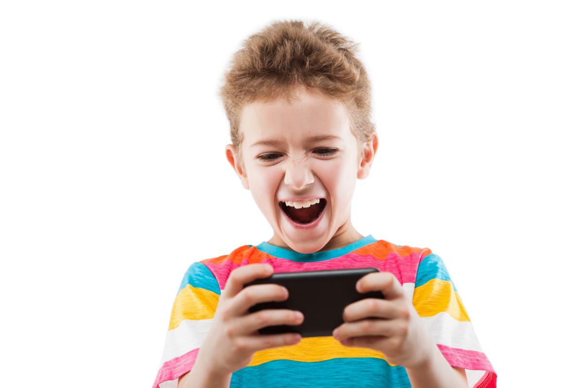 boy playing game on phone