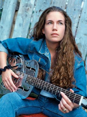 Lady playing a guitar