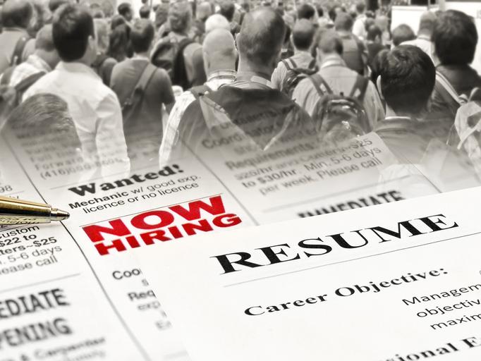 stock photo of a resume and a crowd of people on the street 