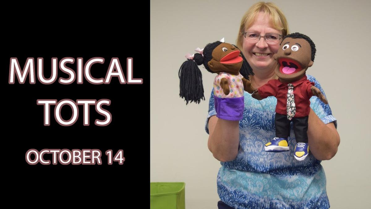 A woman holds a boy puppet and girl puppet next to the text "Musical Tots October 14"